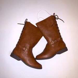 Brown Boots lace up in the back, buckle on the side.